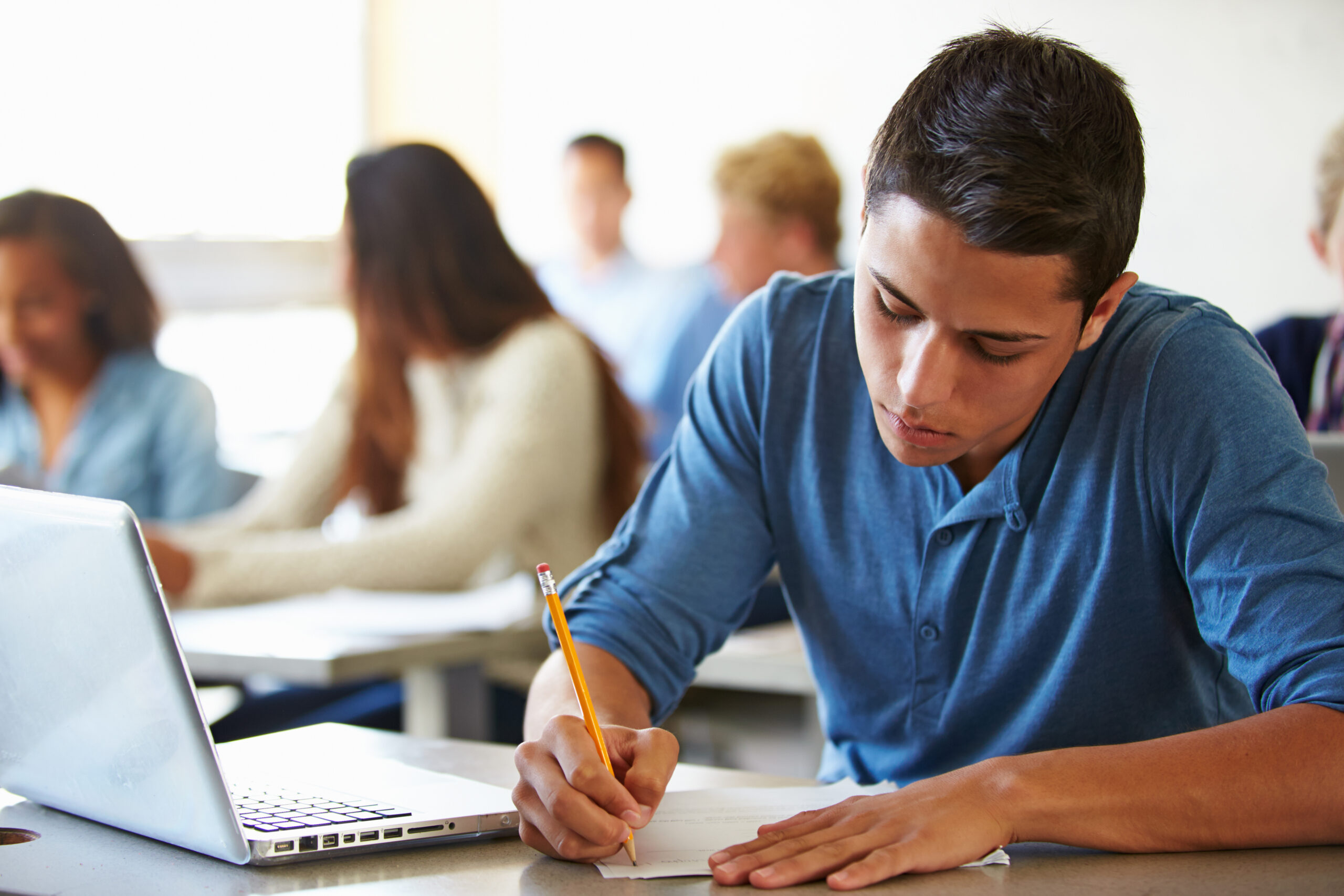 High School Students Taking Test In Classroom